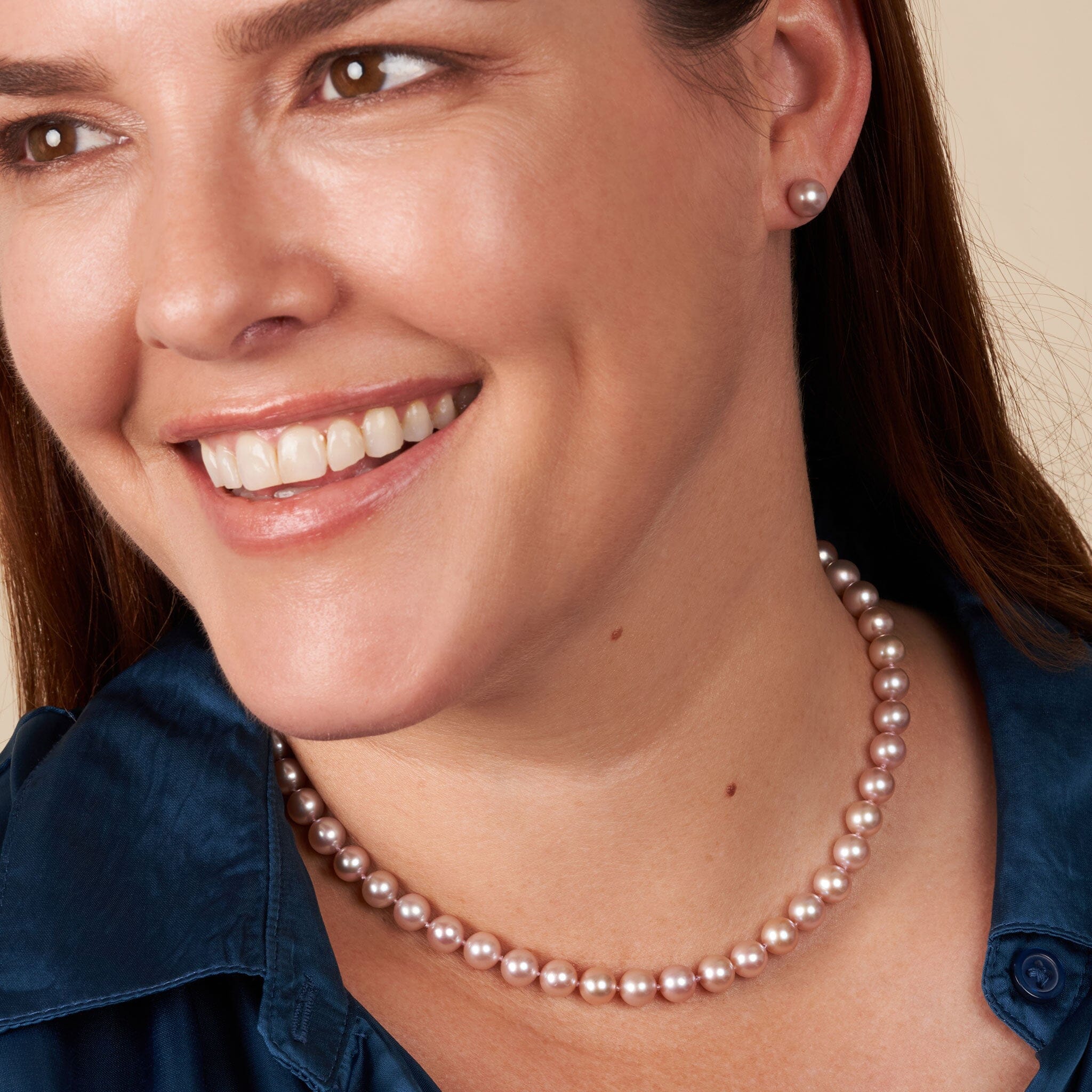 Model wearing strand of 7.5-8.0 mm lavender freshwater pearls