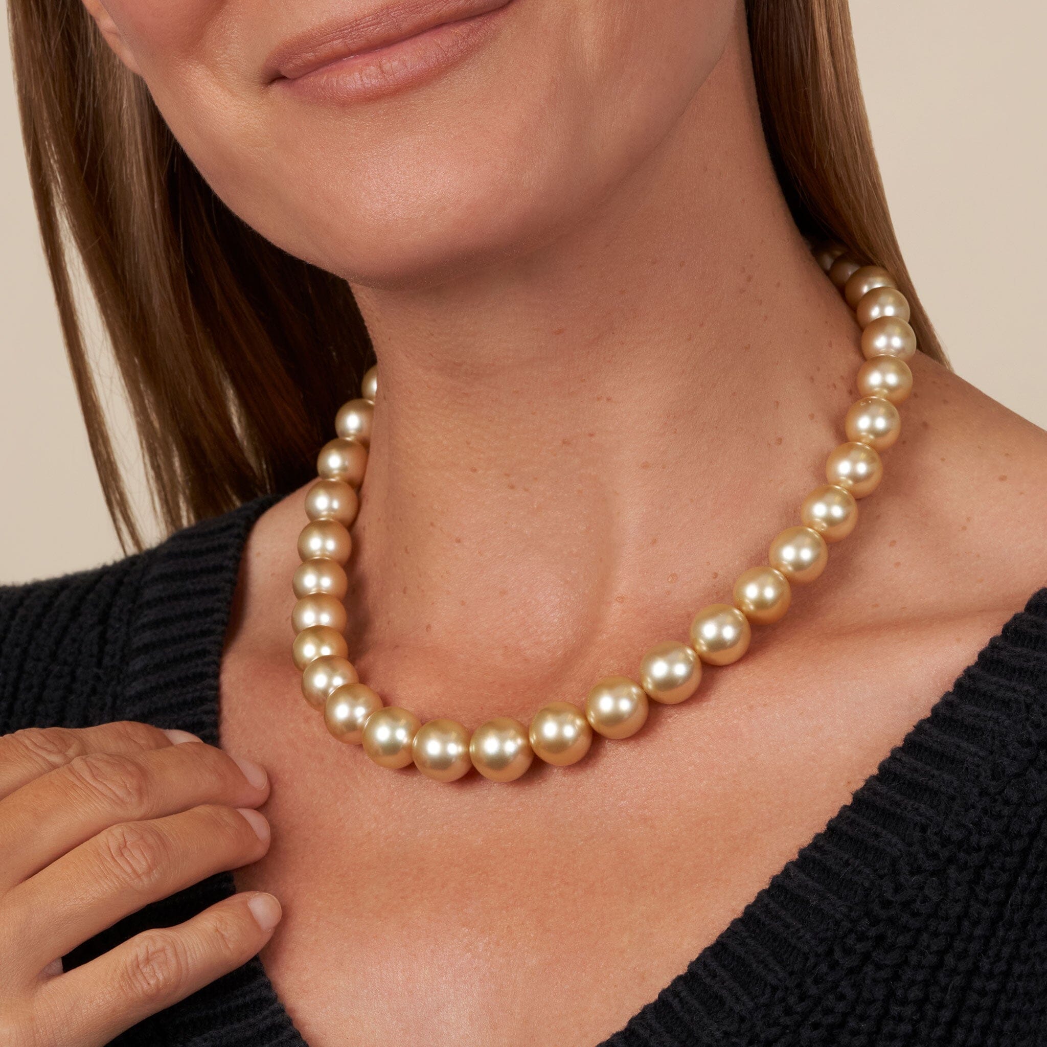 10.0-13.2 mm AA+/AAA Golden South Sea Round Pearl Necklace close up on model