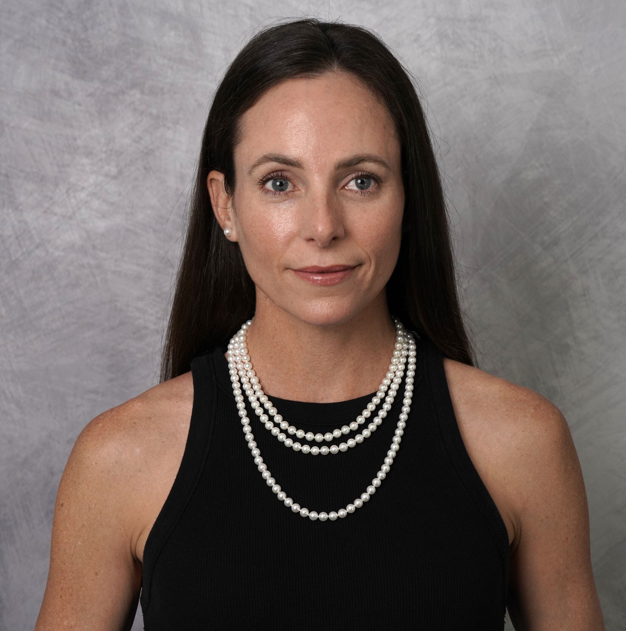 Model wearing a 16, 18 and 22 inch strand of 6.5 mm Akoya pearls